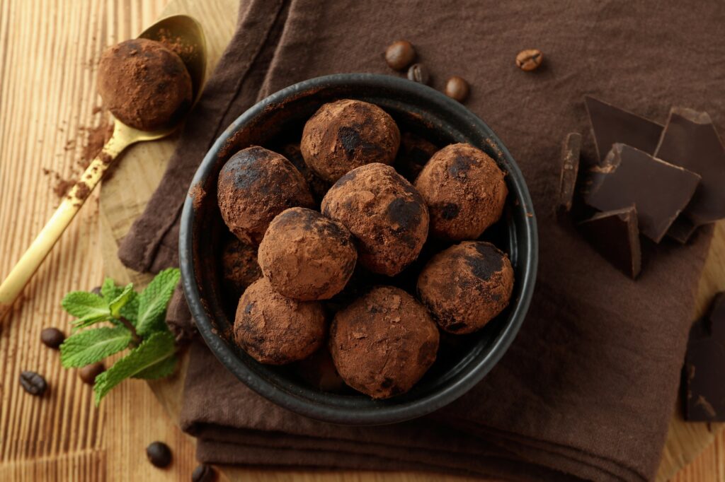 Concept of sweets with truffles on wooden background